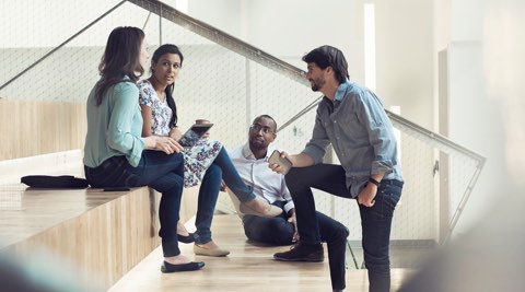 group of people in business casual attire having a discussion